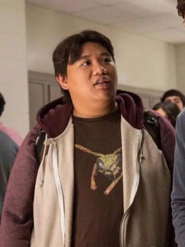Jacob Batalon as Ned Leeds wearing Spider-Man Brand New Day Hooded Jacket standing in school . Spider-Man Brand New Day Ned Leeds Hooded Jacket