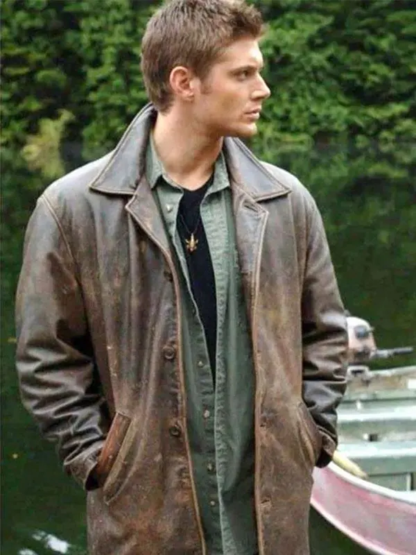 Side angle view of Dean Winchester wearing the distressed brown leather coat outdoors