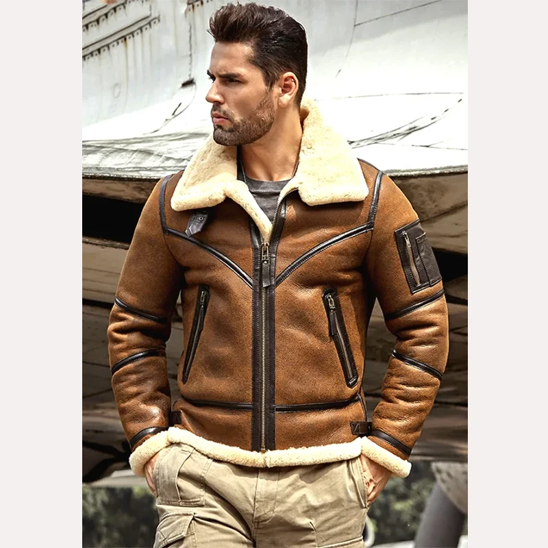 Model wearing Mens Cognac Brown Leather Cream Shearling B3 Jacket zipped near vintage aircraft