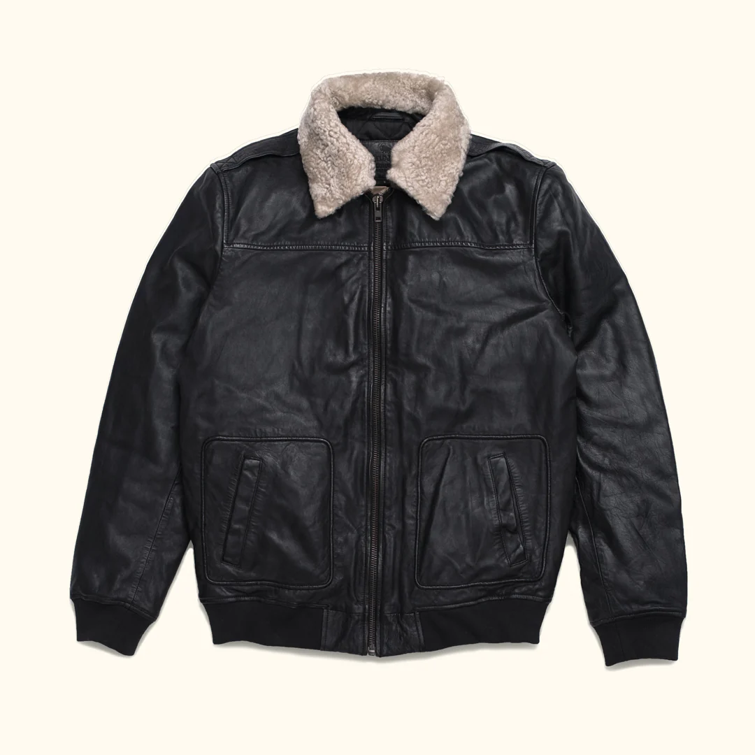 Studio cutout front view of Mens Black Leather Off White Shearling Collar Bomber Jacket