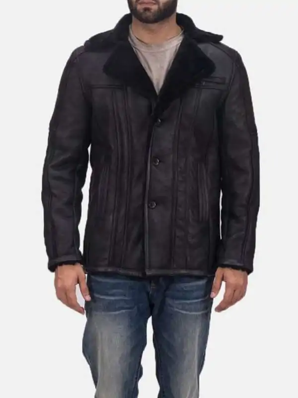 Model wearing Mens Black Leather Black Shearling Button Coat
