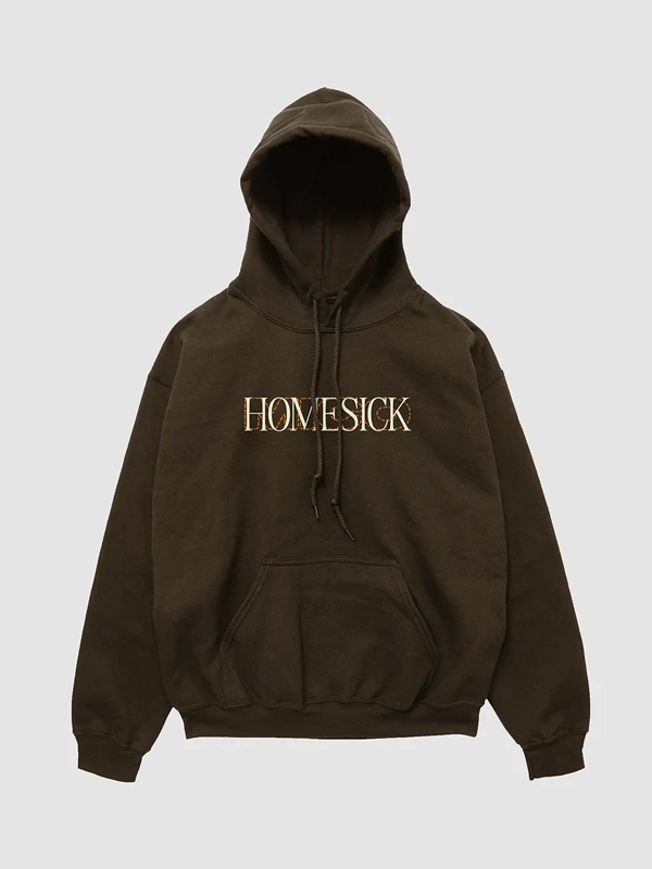 Homesick But Im Just A Tourist To You Hoodie front view showing HOMESICK chest graphic