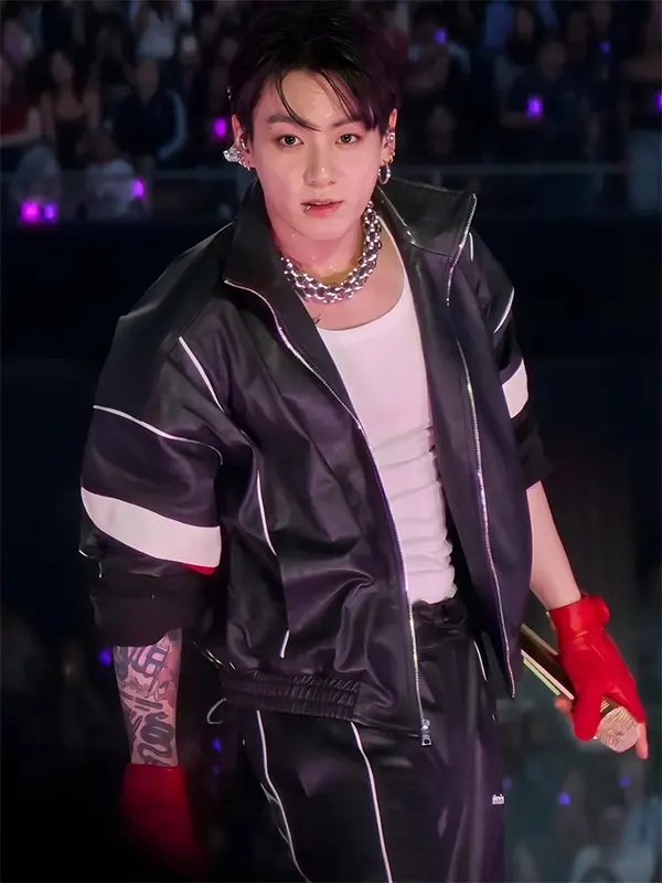 Jungkook wearing the BTS Black Leather Track Jacket on stage during a concert