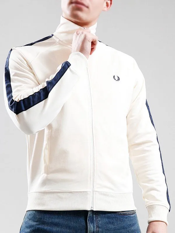 Front view of the off-white track jacket featuring a full-length zipper, stand-up collar, side pockets, and chest logo. Matthew Broome White Tape Track Jacket