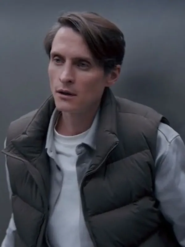 Front view of Pavel Kuzmin wearing the olive green puffer vest with a stand-up collar and front zip. Pavel Kuzmin Your Heart Will Be Broken Green Puffer Vest