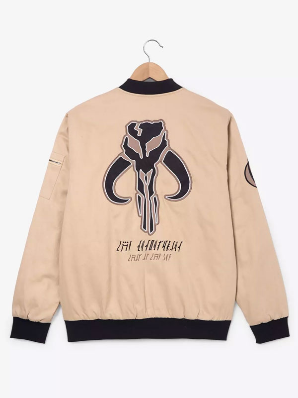 Back view of the khaki cotton flight jacket featuring a large Mythosaur skull graphic and Aurebesh text