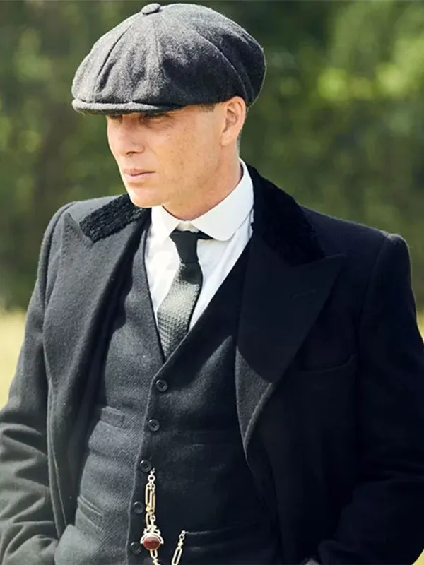 Close-up view of Cillian Murphy as Tommy Shelby wearing the black wool coat and flat cap in Peaky Blinders The Immortal Man. Tommy Shelby Peaky Blinders Black Wool Coat
