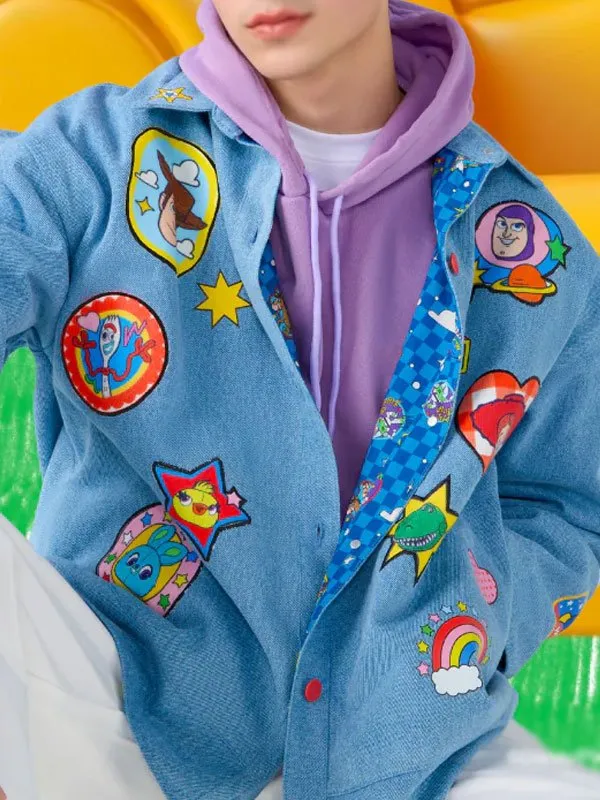 Front view of the blue reversible jacket featuring character embroidery patches and button fastening.Toy Story 5 Kanyarat Chokphanarat Blue Reversible Jacket