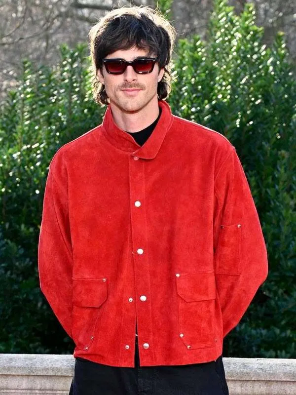 Front view of Jacob Elordi as Heathcliff wearing the red suede jacket in Wuthering Heights. Wuthering Heights Heathcliff Suede Jacket