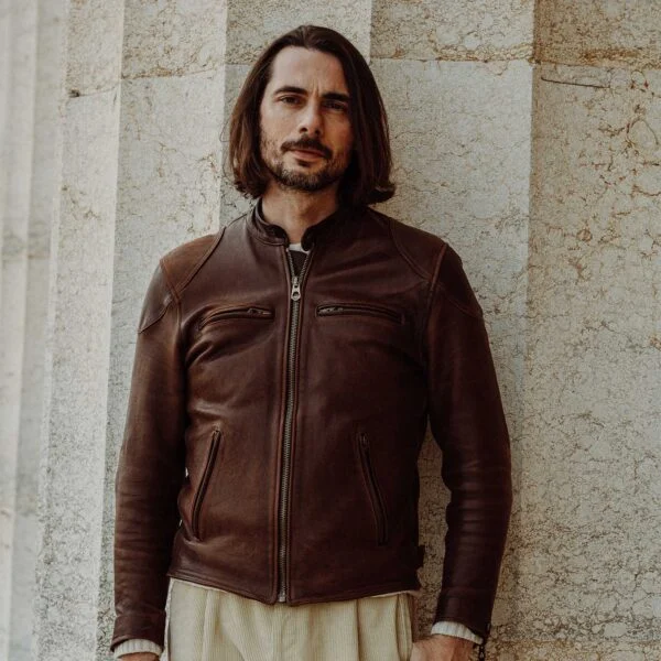 Model wearing Mens Premium Dark Brown Cafe Racer Leather Jacket against architectural background