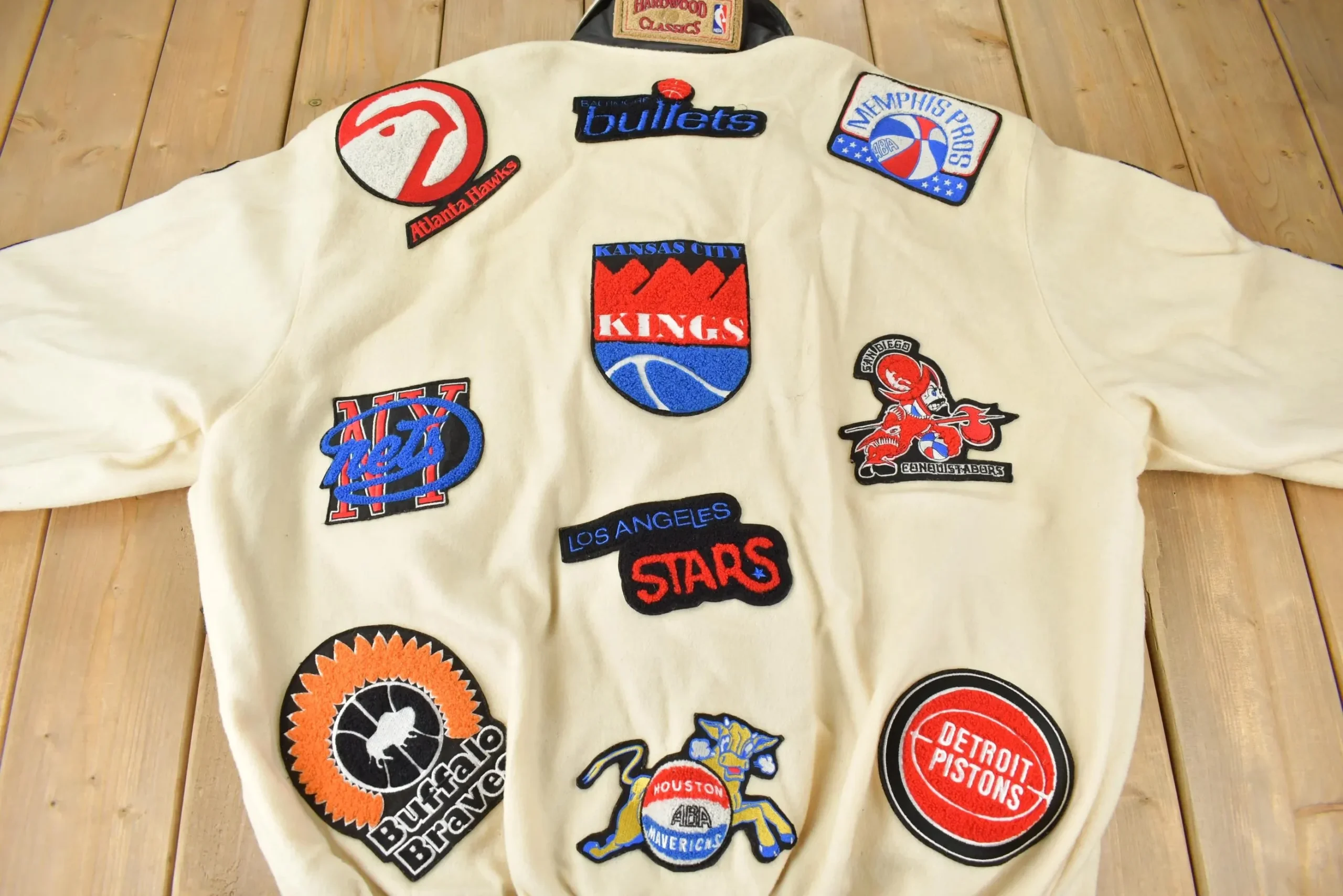 Back view of vintage Jeff Hamilton ABA jacket showing embroidered logos