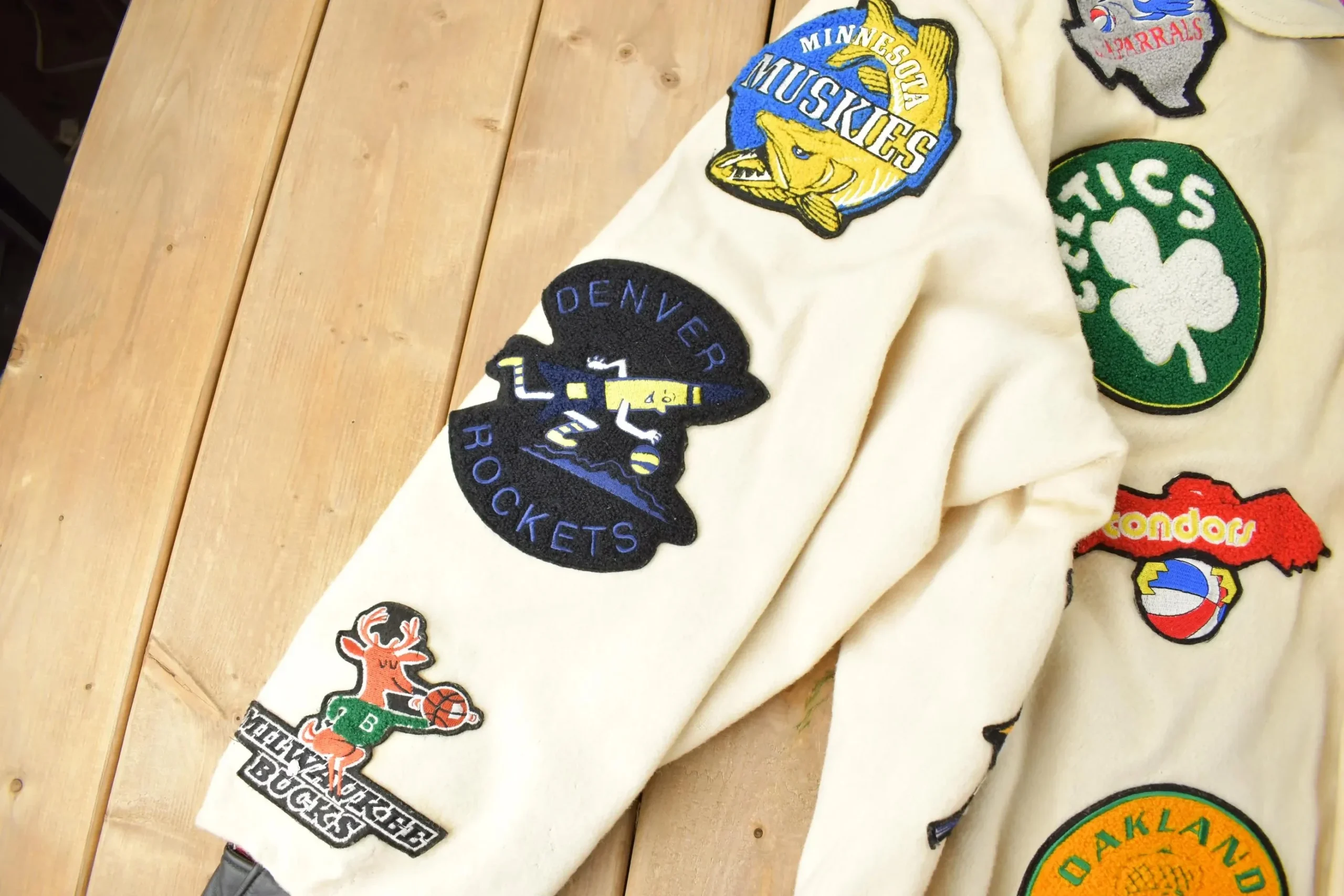 Close up of Oakland Oaks patch and leather pocket trim on vintage Jeff Hamilton ABA jacket