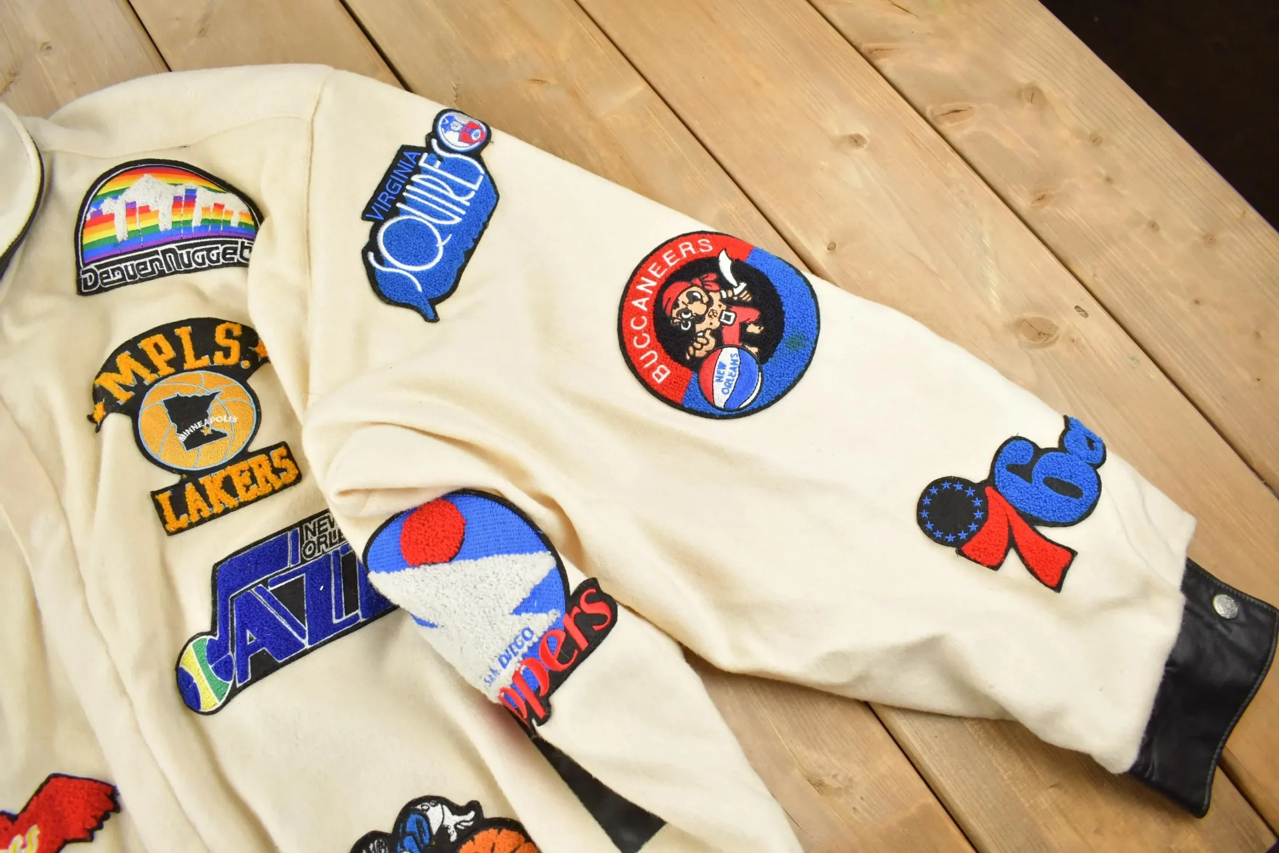 Close up of Oakland Oaks patch and leather pocket trim on vintage Jeff Hamilton ABA jacket