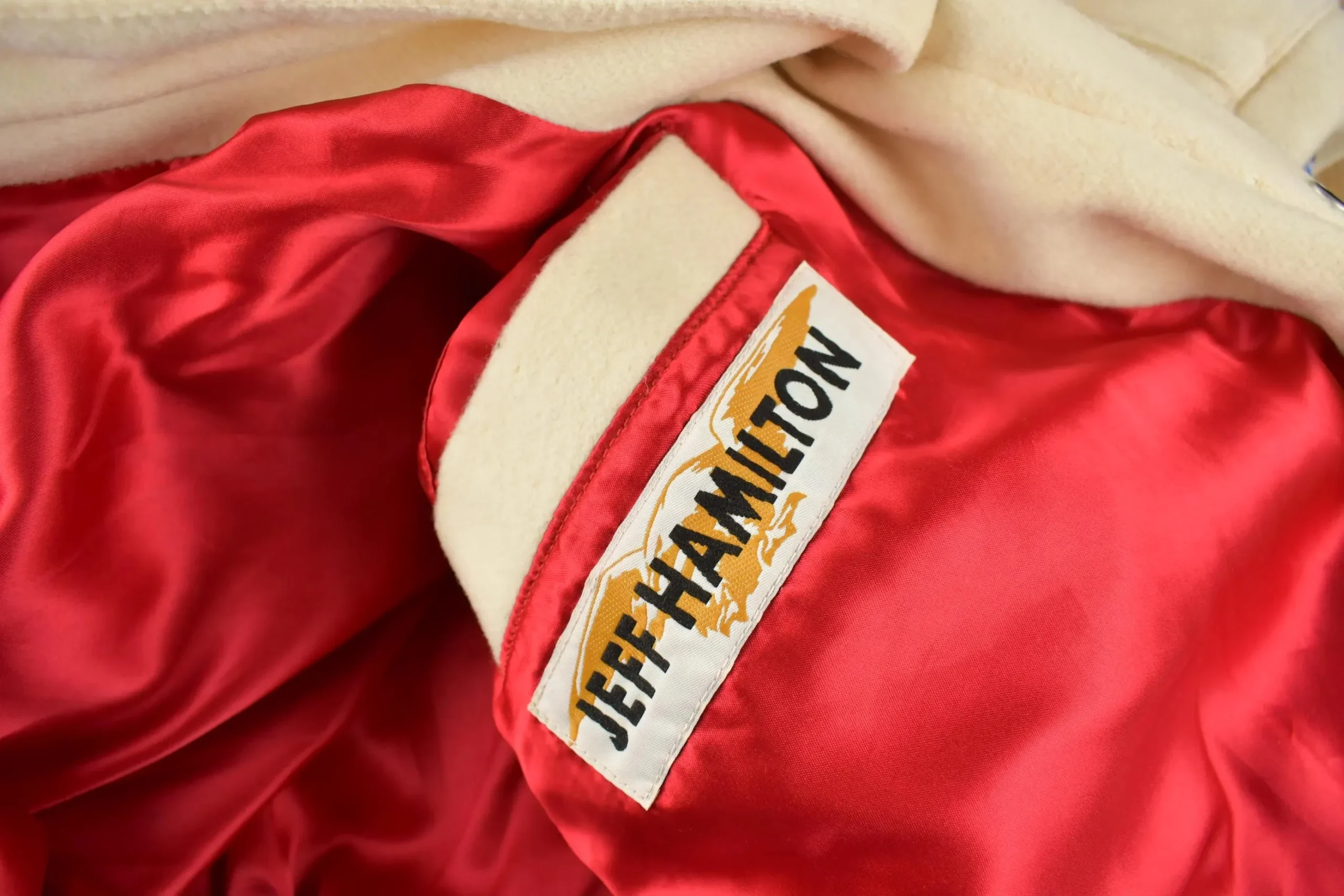 Red quilted satin lining inside a vintage Jeff Hamilton ABA jacket