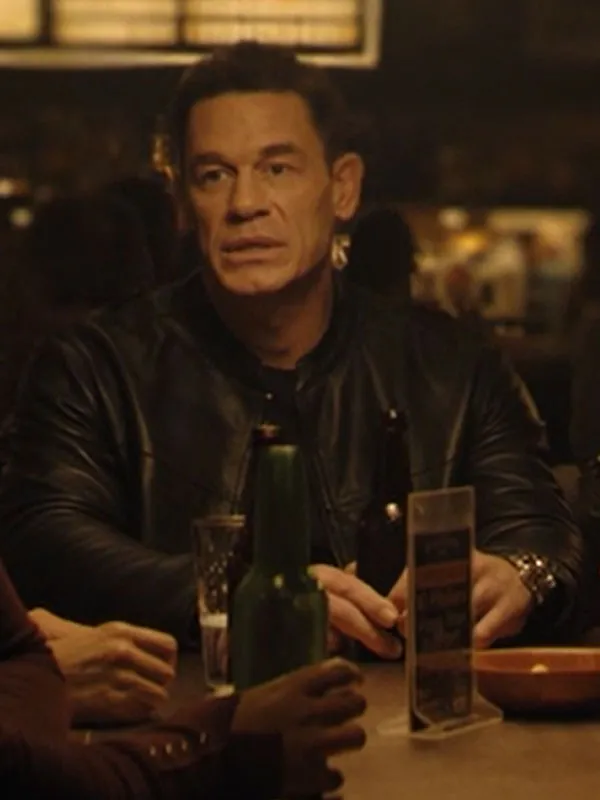 John Cena wearing Matchbox the Movie Black Leather Jacket at a table. Matchbox the Movie John Cena Black Leather Jacket